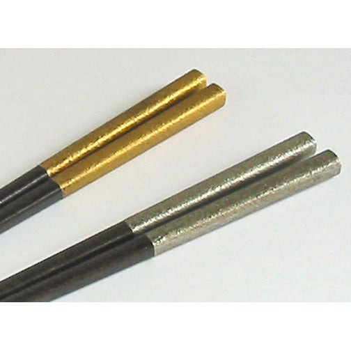 detail of gold and silver finished chopsticks